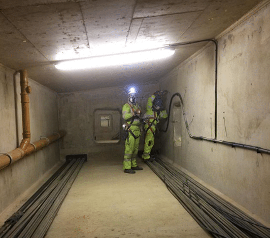 Two Severn Access technicians carrying out a confined space rescue underground