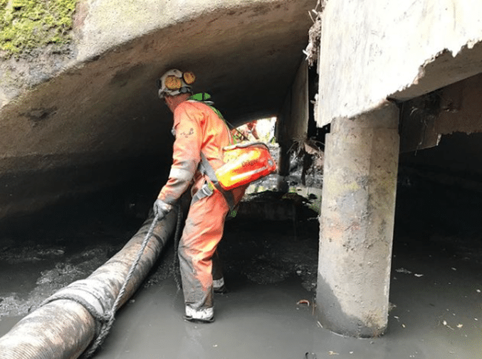 A Severn Access rescue technician carrying out a confined space rescue under a bridge