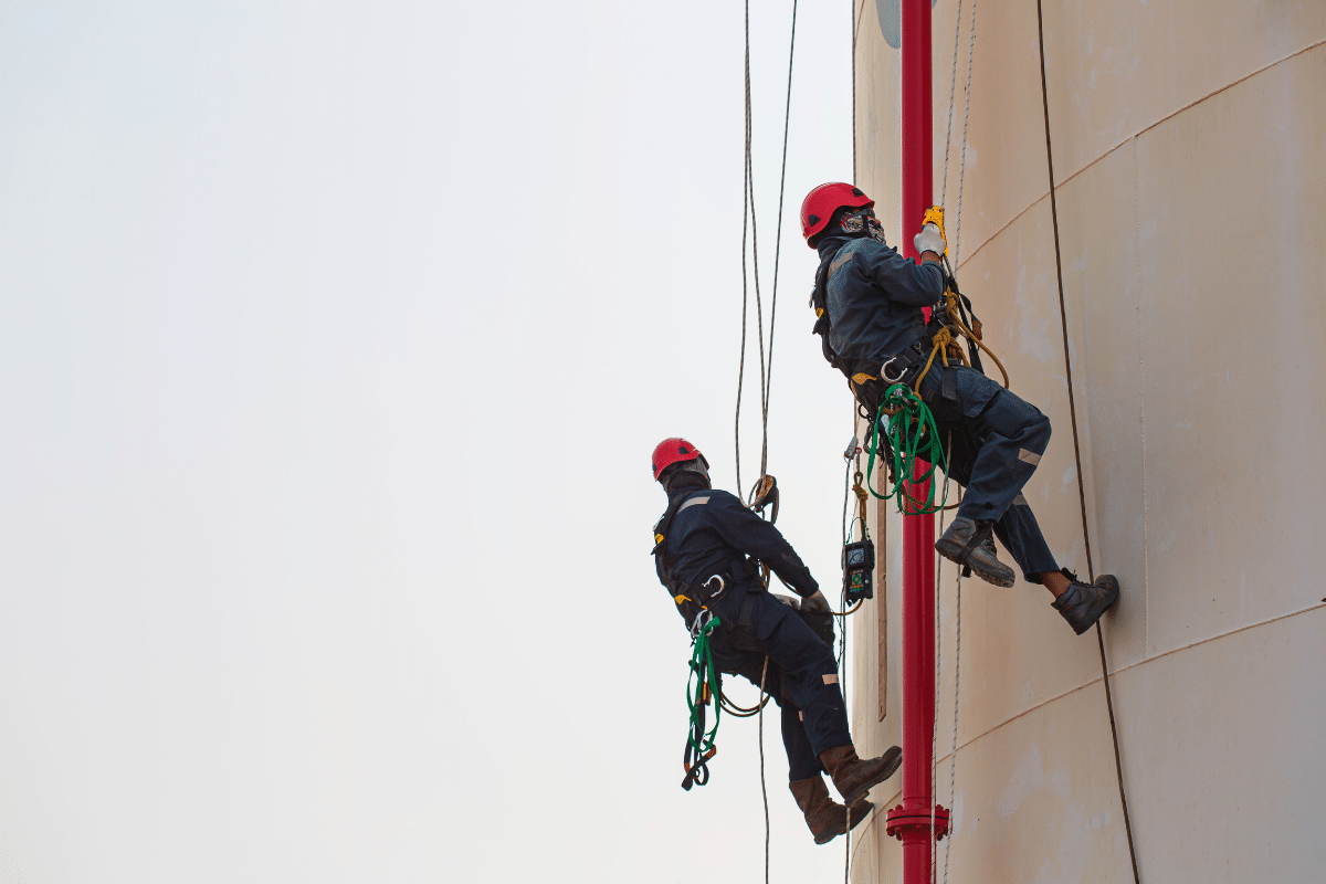 Two Severn Access rope access technicians ascending a silo