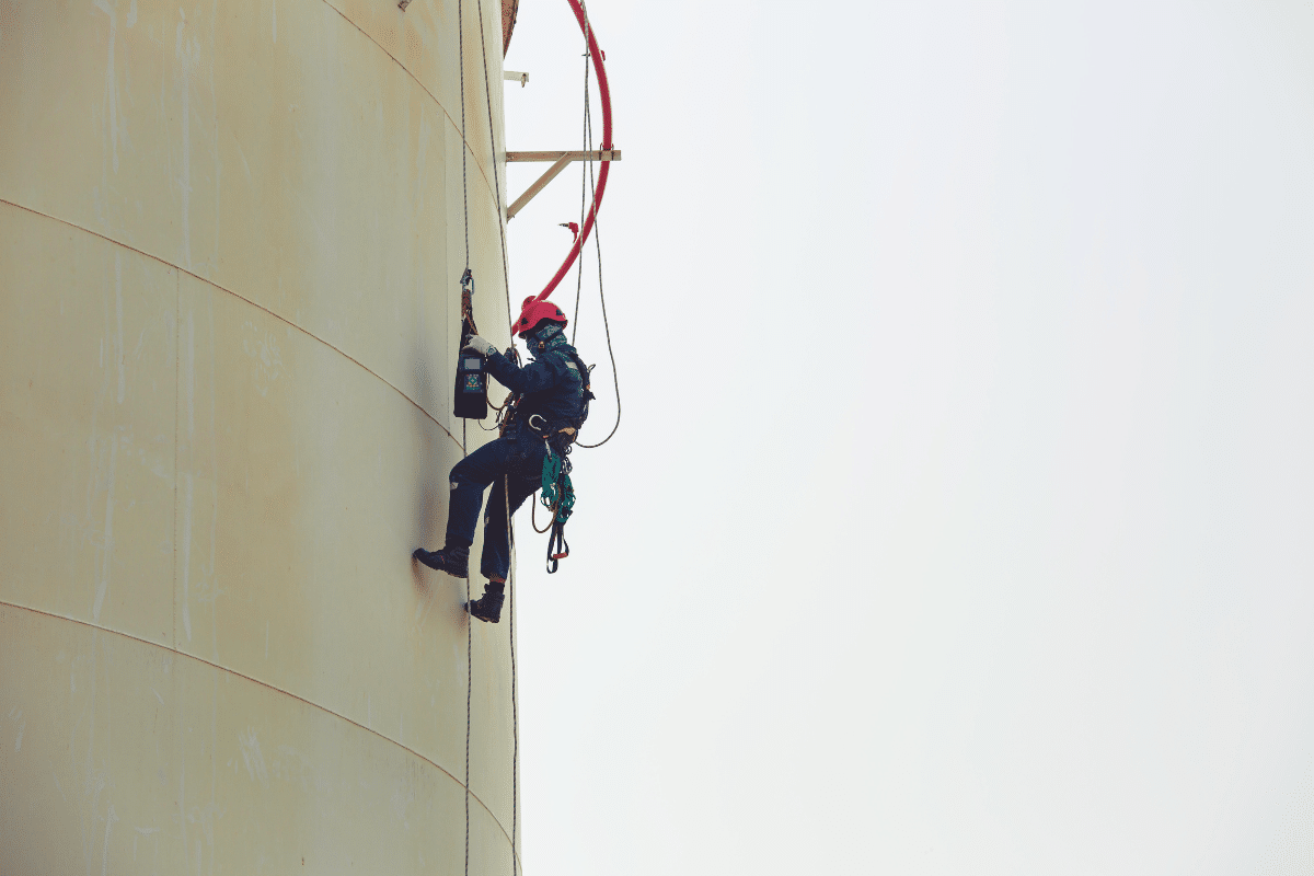 A Severn Access rope access technician ascending a building