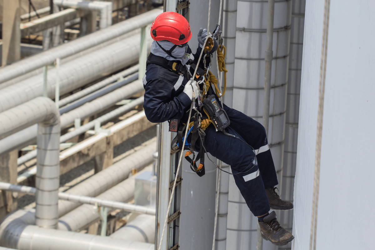 A Severn Access rope access technician ascending a silo to perform silo cleaning