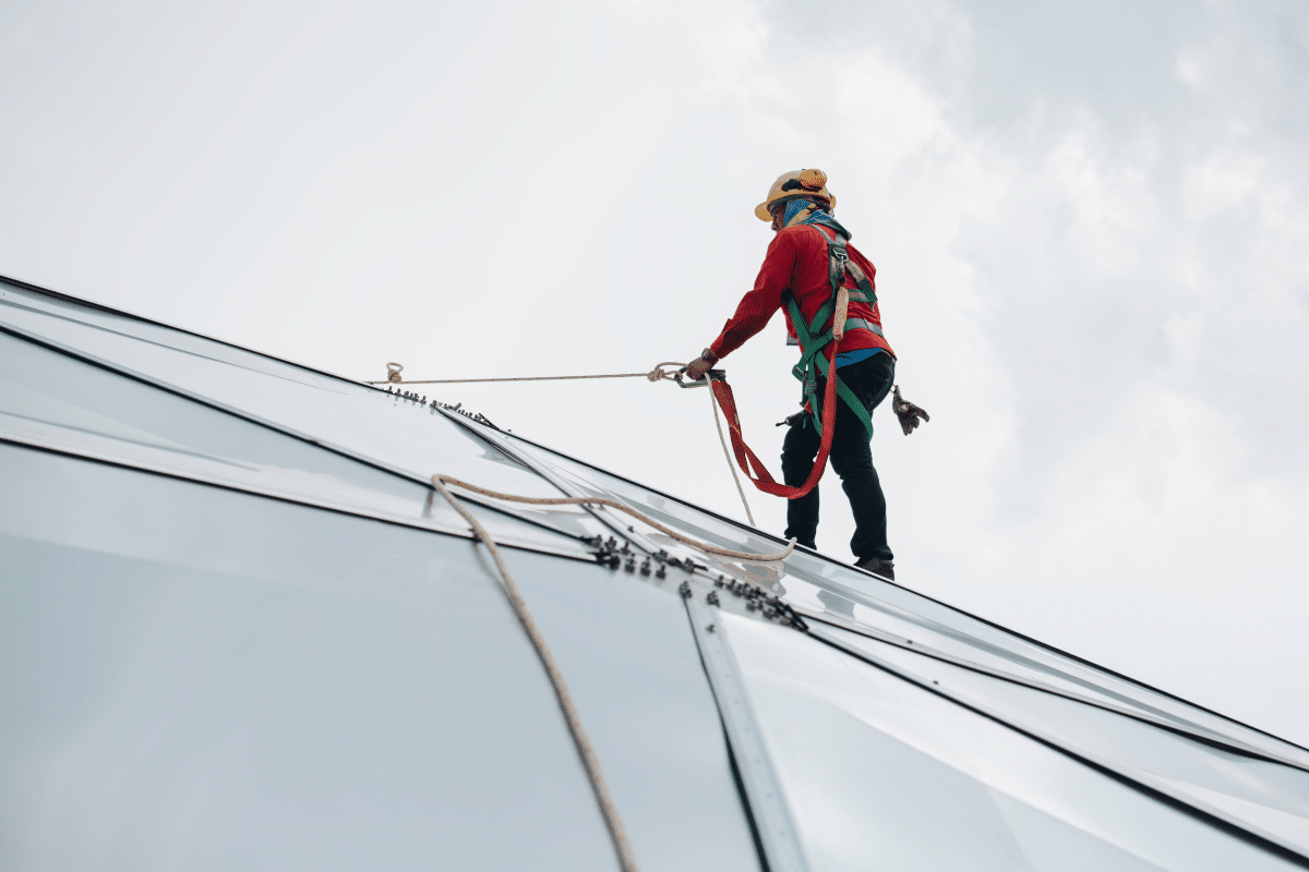 A Severn Access rope access worker performing cladding repairs on a building