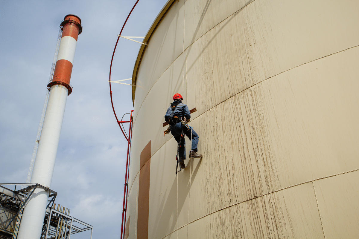 A Severn Access rope access technician carrying out silo cleaning on a silo