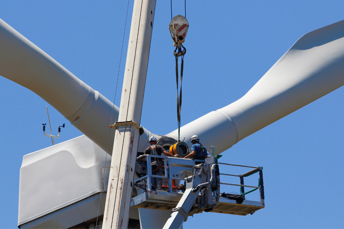 Two Severn Access rope access technicians carrying out wind turbine maintenance on a turbine