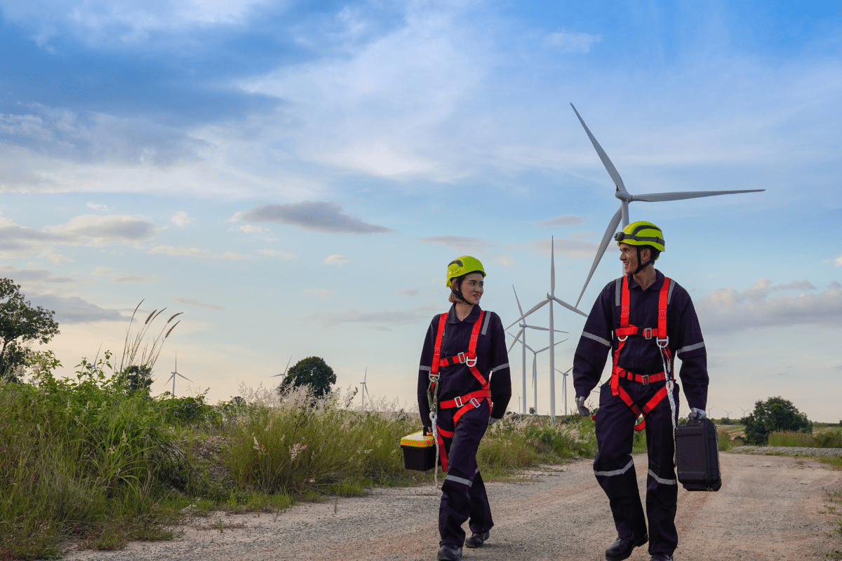 Two Severn Access rope access technicians after carrying out wind farm maintenance on a wind turbine