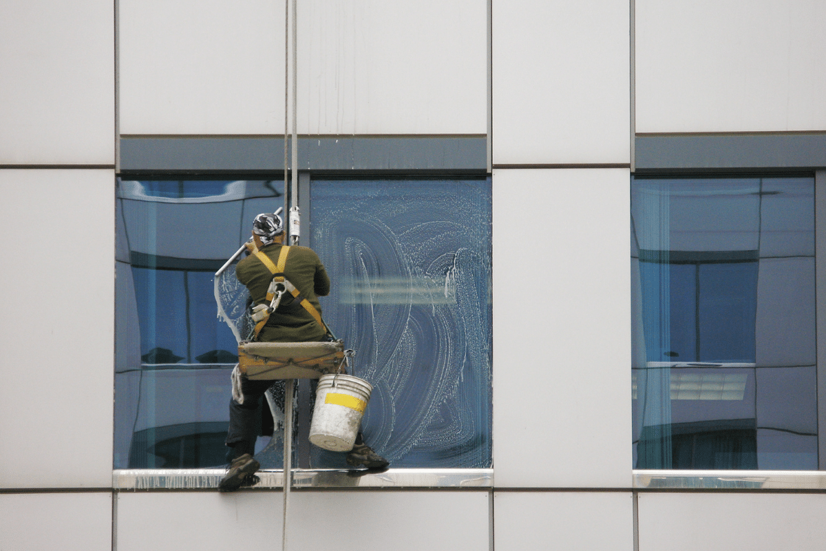 A window cleaner performing work in accordance with the Working At Height Regulations 2005