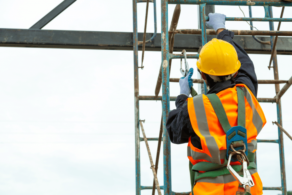 An employee on scaffolding following working at height duty holders responsibilities