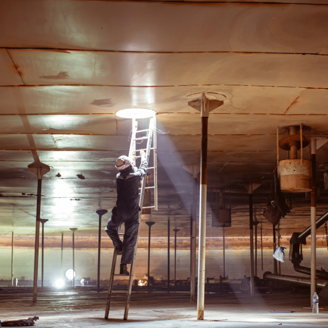 A worker descending into a confined space in Birmingham with a Severn Access confined space rescue team above