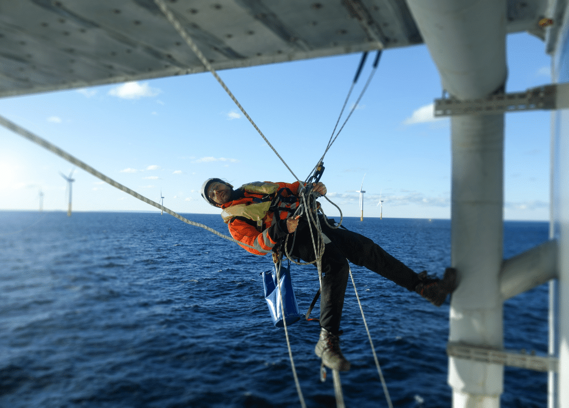 A Severn Access technician performing industrial rope access services & solutions on a wind farm