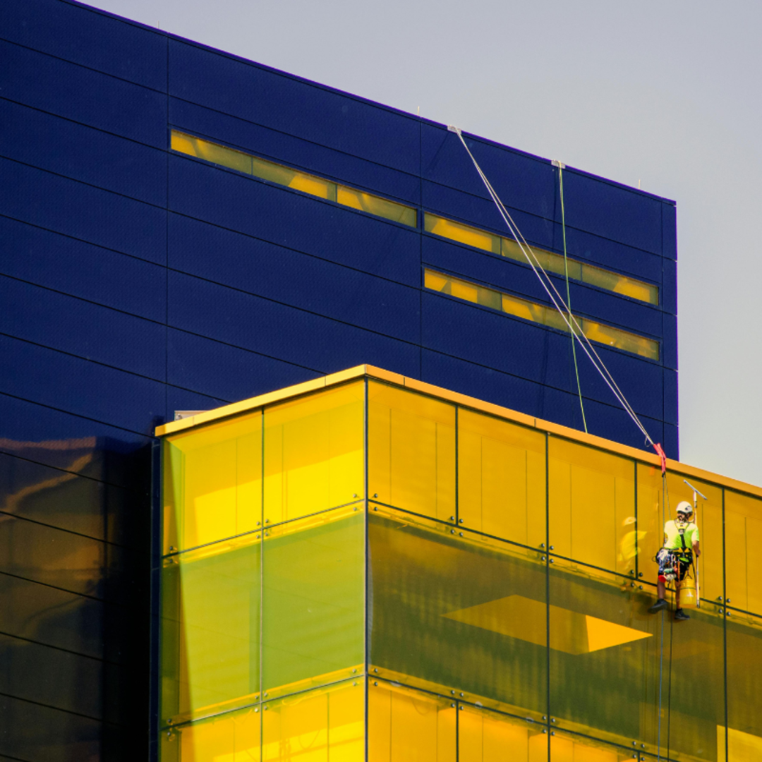 external-façade-cleaning-birmingham External façade cleaning services being performed by a Severn Access rope access technician