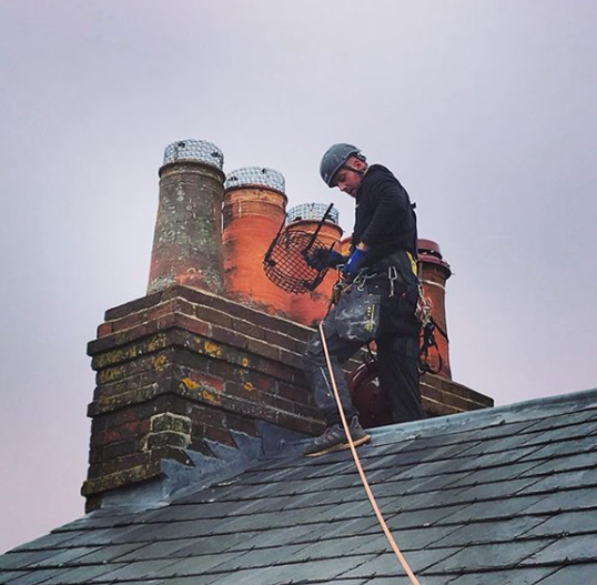 A Severn Access technician delivering rope access services on a domestic property