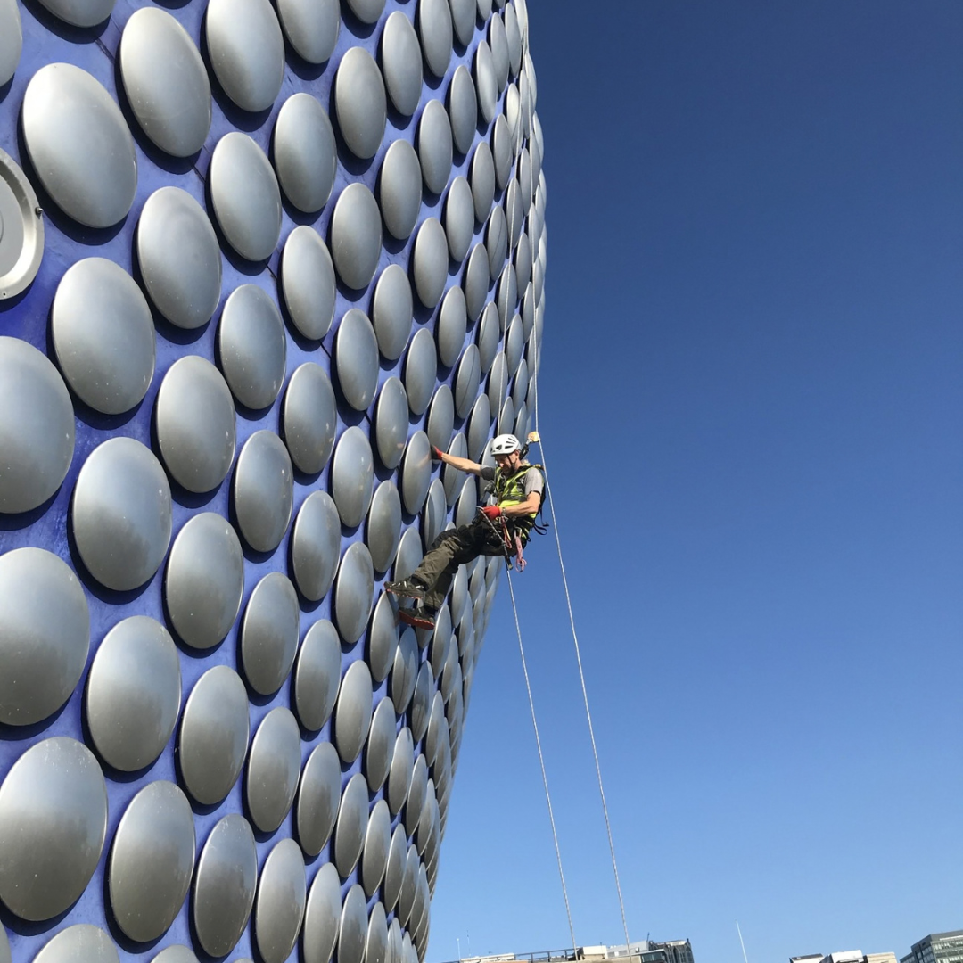 A Severn Access technician delivering rope access services on a commercial building