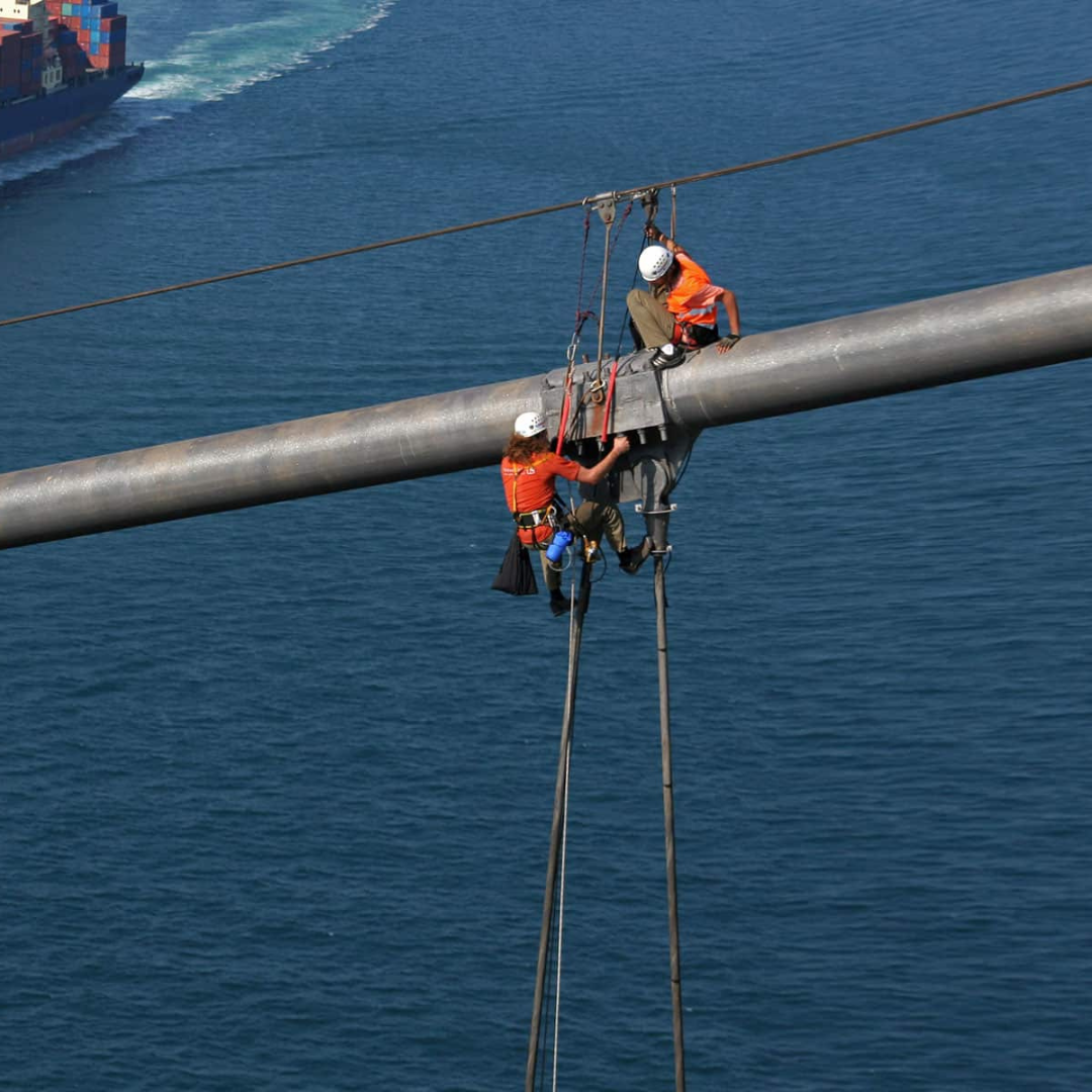 Two Severn Access technicians delivering rope access services on a bridge